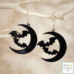 Make a statement with these spooky black bat and moon drop earrings for women. These cool quirky black glittery acrylic Halloween bat earrings are a great way to add a nice touch to your outfit. The charm on these bat dangle earrings measures at 3.6cm x 3.9cm and is attached to a silver plated hook. Please feel free to get in touch with us at Funky Earrings UK if you have any questions. We also have a wide range of other cute and unusual earrings in our shop. Earrings Cool, Moon Drop, Spooky Black, Bat Earrings, Diy Jewlery, Funky Earrings, Unusual Earrings, Halloween Bat, Black Bat