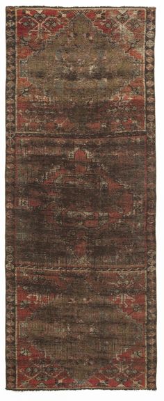 an antique rug with red and brown colors