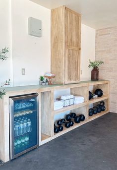 a room that has some bottles on the shelves