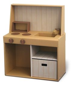 a wooden toy kitchen with drawers and cupboards