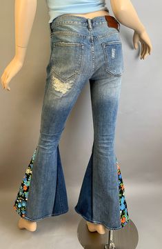 Vintage 70s style up-cycled Allsaints jeans with vintage fabric gussets added. Distressed vintage look denim jeans size 26 low waist tight fit jeans. True waist 26 Low waist 29 Hip 32 Inseam 31 inches Rise 8 Waist to hem 39 Patchwork Flare Jeans Medium Wash For Spring, Denim Blue Patchwork Flare Jeans For Spring, Retro Flare Jeans With Frayed Hem For Spring, Denim Blue Flare Jeans With Patchwork For Spring, Retro Spring Flare Jeans With Frayed Hem, Spring Denim Blue Patchwork Flare Jeans, Spring Patchwork Medium Wash Flare Jeans, Spring Patchwork Flare Jeans In Medium Wash, Summer Patchwork Stretch Jeans