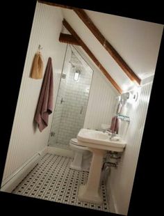 a bathroom with a sink, toilet and shower in it