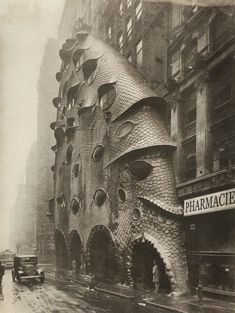 an old black and white photo of a building made out of fish's heads