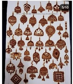 an image of henna tattoos on the back of a white sheet with brown designs