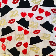 the number twenty nine is surrounded by lipstick and hats with gold glitters on them