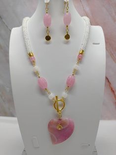 "Handmade and designed by me-one of a kind necklace-white seed bead crocheted rope necklace-1 3/4\"x1 3/4\" heart shaped pink dragon veins agate pendant bead-glass beads-white matte dragon vein beads-2 1/4\" long matching dangle earrings-gold tone toggle clasp in front-22\" long-gold tone findings. This beautiful necklace set would make a great addition to your summer wardrobe! Or give it to Mom for her special day!" Beautiful Jewelry Diamonds, Beautiful Beaded Jewelry, Beaded Necklace Designs, Gemstone Pendant Necklace, Necklace Ideas, Crochet Rope, Handmade Jewelry Tutorials, Jewelry Design Necklace, Gemstone Necklace Pendant