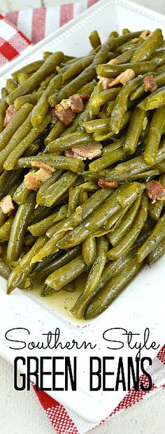 southern style green beans on a white plate with red and white checkered tablecloth