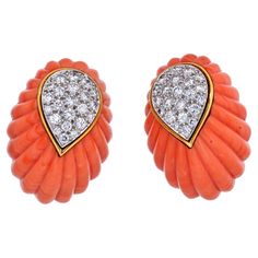 Carved coral and diamond clip-on earrings by David Webb. From David Webb, a pair of diamond and fluted coral earrings. The earrings boast brilliant cut diamonds weighing approximately 2.50 carats. Set in 18 Karat gold and platinum. 1 1/8 High 5/8 wide. Comes with a vintage David Webb box. Haute Jewelry, Ocean Gifts, David Webb, Coral Earrings, Coral Jewelry, Antique Earrings, Diamond Design, Sparkle Diamonds, Intricate Details