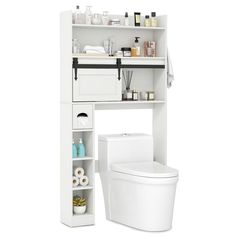 a white toilet sitting next to a shelf filled with bathroom items