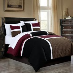 a bed in a room with a brown and white comforter