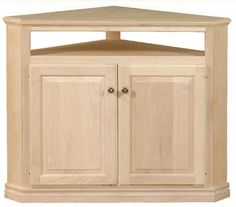 a corner cabinet with two doors and cupboards