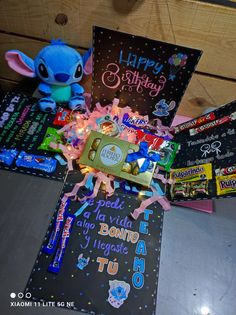 a table topped with lots of candy and cards