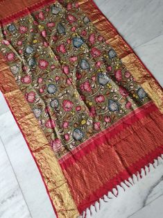 Pure Kanchi Silk Duppatta with Pen Kalamkari  work.  Length 86 inches  width 48 inches. Tassels done Please note that Pen Kalamkari works can leave ink droplets on fabric, the ink may run in places. They do not count as damage. That is part of the process. Kalamkari Painting, Saree Designs, Pen, Floral Prints, Saree, Silk, Pure Products, Red, Clothes For Women