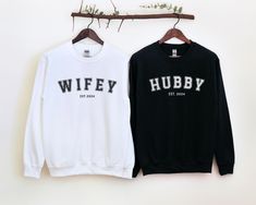 Hubby & Wifey Shirt, Wifey and Hubby EST. 2024 Shirt, Wedding Gift, Honeymoon Outfit, Personalized Engagement Gift For Bride These garments are made from polyester and cotton. This combination helps designs come out looking fresh and beautiful. The collar is ribbed knit, so it retains its shape even after washing. There are no itchy side seams on these sweaters. .: FABRIC: Medium-heavy fabric blend of 50% cotton and 50% polyester (8.0 oz/yd² (271.25 g/m this sweatshirt feels cozy and is the perfect choice for those colder months. Made using 100% ethically grown US cotton from a proud member of the US Cotton Trust Protocol, ensuring ethical and sustainable means of production. The blank shirt's dyes are OEKO-TEX-certified dyes with low environmental impact. .: FIT: The classic fit, along wi Hubby Wifey Shirts, Engagement Gifts For Bride, Wifey Shirt, Personalized Engagement Gifts, Honeymoon Outfits, Gift For Bride, Fabric Medium, Bride Gifts, Engagement Gifts