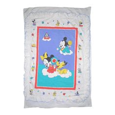 a mickey mouse and minnie mouse blanket on a white background with blue trimmings