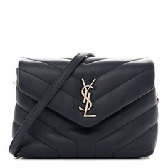 This is an authentic SAINT LAURENT Calfskin Y Quilted Monogram Toy Loulou Chain Satchel in Medium Blue. This elegant shoulder bag is crafted of chic chevron quilted calfskin leather in dark blue. The bag features a leather shoulder strap and silver hardware. The frontal flap features a prominent silver tone YSL and opens to a partitioned black fabric interior with card slots, a zipper and patch pockets. This is an ideal bag for your collection for day or evening, with the classic chic only from Yves Saint Laurent! Chevron Quilt, Classic Chic, Silver Hardware, Medium Blue, Black Fabric, Patch Pocket, Card Slots, Yves Saint Laurent, Calf Skin