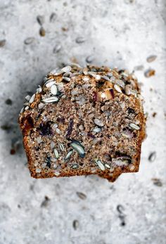 a piece of bread with nuts and seeds on it