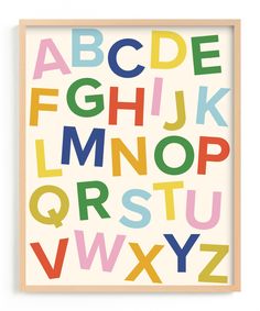 a black framed print with colorful letters on the front and bottom, all in different colors