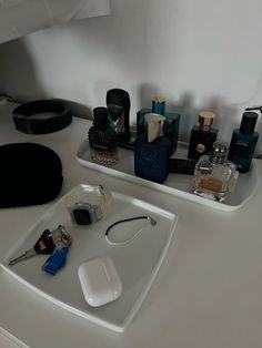 a bathroom sink with various personal care items on top of it and a mirror above the sink