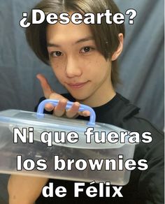 a young man holding a plastic container with the words descarte written on it