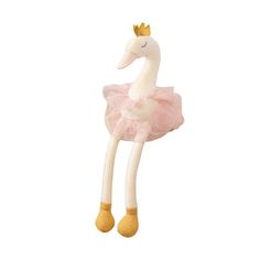 a stuffed animal in a pink dress with a gold crown on it's head