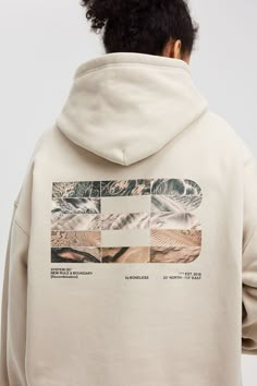 Introducing the FW23 LOGO Textures Graphics Hoodie, where nature meets urban style. On the back, a monumental logo merges a medley of natural textures, including mountains, rivers, deserts, etc. This intricate design contrasts with the elegantly subtle logo on the left chest. Crafted in a premium heavyweight fabric, this hoodie offers both style and substance, finished with a slightly oversized silhouette for a contemporary touch. Natural texture-infused back logo Subtle left chest LOGO Premium Back Graphic Hoodie, Best Hoodie Design, Man Pattern Design, Graphic Design Sweatshirt, Trending Hoodie Designs, Hoodie Design Graphic, Merchandise Design Graphics, Hoodie Merch Design, Graphic Design For Hoodies