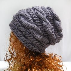 a knitted hat is shown on top of a mannequin's head