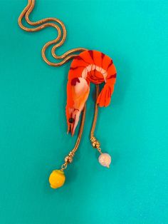 Paradise lost 🦐 One of the most fun we've seen on a bolo--the shrimp slides on a gold-plated snake chain and is adorned with a handmade lampwork glass lemon and pearl. ✦ Handmade and pressed in acrylic and mounted on wood. ✦ Made with ✨ in Kansas City, MO. ✦ As much as possible, keep out of humid areas like the bathroo Shrimp Necklace, Sea Creature Jewelry, Glass Bead Crafts, Paradise Lost, Metalwork Jewelry, Funky Earrings, Book Clothes, Bandana Hairstyles, Kansas City Mo