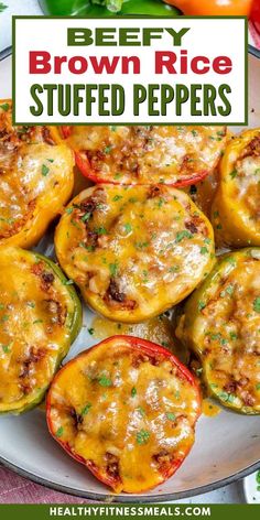 stuffed bell peppers with cheese and herbs in the middle on a white plate, surrounded by fresh vegetables