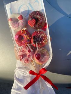 a bag filled with lots of donuts on top of a table