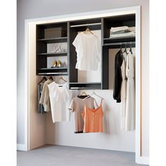 an open closet with clothes and shoes on hangers