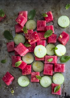 watermelon, cucumber and mint slices on a baking sheet