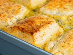 a casserole dish with chicken and cheese in the baking pan, ready to be eaten