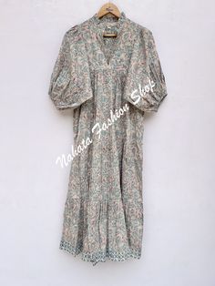 ITEM DESCRIPTION brown green floral long maxi dress- V neckline printed women's dress -  with elastic sleeves Features: 3/4th sleeve, V neck, Long dress Fabric : 100% Cotton Cambric hand block print fabrics  Sleeve Length = 22 inch For more sizes & their measurement, please refer our below chart to understand the sizes variations available with us For your size requirement, please mention your size in seller note at the time of buying. SIZE MEASUREMENT  BUSTLENGTHSHOULDER XXS34 inch51 inch13.5 inch XS36 inch51 inch14 inch S38 inch51 inch14.5 inch M40 inch51 inch15 inch L42 inch51 inch16 inch XL44 inch51 inch16.5 inch 2XL46 inch51 inch17 inch 3XL48 inch51 inch18 inch   Company Return Policy:  Please write for more information to my email directly CHOOSE "ASK SELLER QUESTION" Payment policy: Green V-neck Cotton Midi Dress, Green Cotton V-neck Maxi Dress, Green Boho Dress With Floral Print And V-neck, Green V-neck Cotton Maxi Dress, Printed Cotton Maxi Dress With V-neck, Printed Cotton V-neck Boho Dress, V Neck Long Dress, Elastic Sleeves, Hand Embroidery Videos