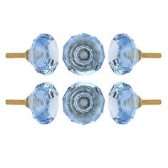 four glass knobs with wooden handles on a white background