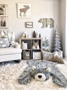 a living room filled with lots of furniture and christmas trees on the wall behind it