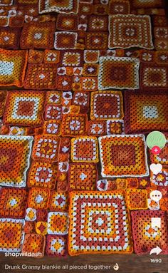 crocheted squares are laid out on the floor to be used as afghans