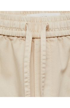 Go for a laid-back look in these light and drapey cotton-twill pants made with a comfy pull-on waist and full-length wide legs. Elastic/drawstring waist Front slant pockets; back patch pockets 100% cotton Machine wash, line dry Imported Cream Cotton Drawstring Bottoms, Cream Cotton Bottoms With Drawstring, Cotton Paperbag Waist Bottoms For Loungewear, Spring Cotton Cargo Pants With Elastic Cuffs, Relaxed Fit Cotton Paperbag Waist Bottoms, Relaxed Fit Cotton Bottoms With Paperbag Waist, Cotton Paperbag Waist Bottoms With Relaxed Fit, Spring Cotton Pants With Paperbag Waist, Beige Cotton Loungewear Cargo Pants