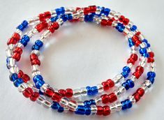 "These American flag colored bracelets are made with red, blue and clear colored seed beads. They come in a set of three bracelets, perfect for stacking together. If you are looking for a different size, please message me. I can make it for you! These beads are on a high quality elastic cord and I did use a surgeon's knots to secure them. However if the bracelets are pulled or overstretched, it can snap and your beads will spill everywhere!  Always put your bracelets on by gently rolling them on your wrists and roll them off on your wrist to remove it.  How to Measure Your Wrist for Proper Bracelet Size Wrap a flexible measuring tape around the smallest part of your wrist then add half an inch. If you don't have a flexible measuring tape, wrap a string around the smallest part of your wris Seed Bead Jewelery, Blue Bracelets, Patriotic Bracelet, Bracelets Red, Red Beaded Bracelet, Clay Bracelet, Red Jewelry, Homemade Jewelry, Unisex Bracelets