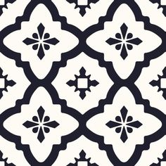 a black and white tile pattern with an ornate design on the bottom half of it