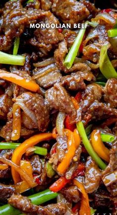 beef and peppers stir fry in a wok