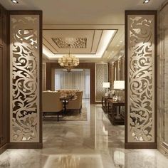 an elegant entry way leading to a living room and dining room with chandelier