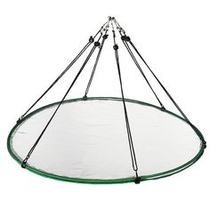 a green and white trampoline suspended from the ceiling with four poles attached to it