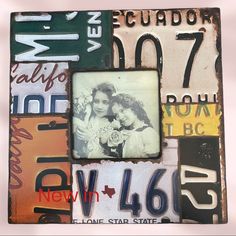 an old photo frame has been decorated with many different colors and designs, including letters