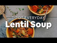 two bowls filled with lentils and carrots on top of a gray countertop