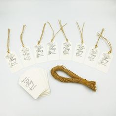 there are many tags that have been placed on top of each other with string attached to them