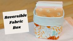 several fabric boxes are stacked on top of each other with the words reversible fabric box