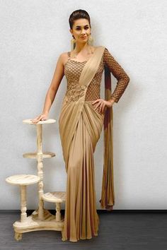 Shop for Jade By Ashima Beige Draped Saree Gown for Women Online at Aza Fashions Draped Saree Gown, Embellished Saree, Saree Gowns, Drape Sarees, Long Blouse Designs, Gown Designs, Designer Sarees Wedding, Draped Saree, Saree Draping Styles