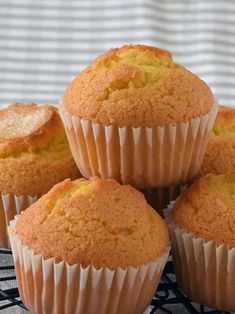 several muffins sitting on top of a black and white plate