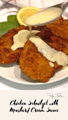 chicken schnitz with mustard cream sauce on a plate